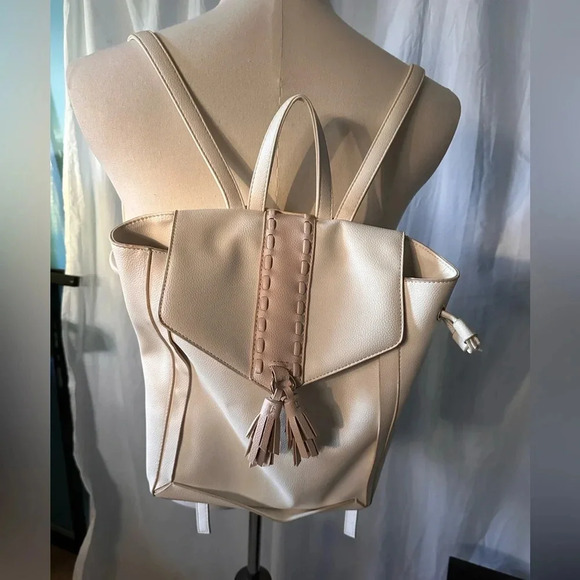 Lionel Backpack Purse. Cream. Snap Closure. Pockets. Adjustable Straps. - Picture 1 of 7